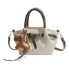 Bolso Cubo de Alta Gama con Patrón de Lichi Transfronterizo Nuevo Estilo Primavera 2026 Bolso de Mano y Bolso Cruzado de Moda Diseño de Nicho Moda Bolso Ala