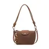 Bolso de axila minimalista de moda coreana y japonesa con un toque de alta gama, nuevo bolso de hombro y bandolera para mujer 2026 con patrón tejido de invierno