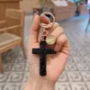 Nova argila com chaveiro de chave cruzada furada chaveiro de carro de diamante ornamentos de bolsa criativos unissex transfronteiriço