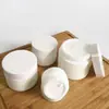 Venta al por mayor del fabricante Botella de Crema de Porcelana Blanca 1 oz 2 oz Botella de Cosméticos de Jade Blanco Botella de Cáñamo Botella de Vidrio para Crema Facial