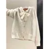 Cárdigan de punto con lazo de encaje para mujer, otoño e invierno, con botones en forma de corazón, suéter de corte holgado, top suave y femenino, prenda de abrigo