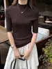 Top de punto para mujer con cuello medio alto, manga media, adelgazante, nuevo estilo 2026, top básico de color liso, suéter versátil de manga corta