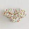 Falda-pantalón triangular de algodón floral para niñas de verano con ribete de encaje festoneado y diseño de flor de pastel