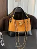 Bolso tote de cadena con patrón de rombos estilo Chanel pequeño para mujer 2026 nuevo bolso de mano de alta gama bolso de hombro único cruzado
