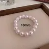 Venta al por mayor transfronteriza de pulseras con cuentas de perlas Shijia, pulseras de moda de lujo ligero estilo francés, accesorios de mano versátiles elegantes de lujo ligero para uso diario