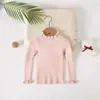 Suéter Feminino com Gola Alta e Babados 2026 Nova Coleção Primavera e Outono Cor Sólida Camisa Básica de Tricô para Crianças Mais Velhas