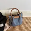 Bolso Moda Textura Viaje Bolso de Hombro Único Cubo Bolso Cruzado Madre-Hija 2026 Otoño Portátil Moderno Elegante Nuevo Coreano