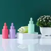 Botella cuentagotas de vidrio con cabeza de silicona color macarrón botella de muestra para viaje subempaque botella cosmética vacía botella para líquidos botella de esencia