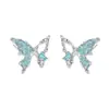 Accesorios nuevos aretes de mariposa irregulares con circonita azul personalidad de nicho femenina aretes de lujo ligero de moda venta al por mayor