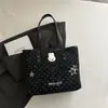 Bolso de mano lindo de lunares de gran capacidad para mujer, versión coreana, bolso tote de nicho para el día a día, bolso de hombro casual de moda para el trabajo