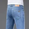 Jeans para hombre del pueblo de Xintang, Guangzhou, estilo fino de verano, nuevo modelo 2026, corte recto holgado, pantalones largos de alta gama para hombre, primavera y otoño