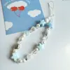 Nueva cadena para teléfono móvil con cuentas de cerámica, estrella de mar, perla, cámara ccd, cordón hecho a mano, linda, portátil, para mujer, transfronteriza