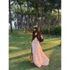 'Estilo igual ao de Yi Mengling' Camisa de Manga Longa com Decote em V e Babados Feminina Nova Estilo Primavera Temperamento Emagrecedor Saia Longa Evasê