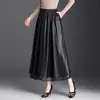 Elegante saia midi em couro PU de corte A para mulheres, nova moda outono 2026, saia evasê versátil de cintura alta que cobre o quadril