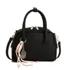 Bolso de mujer de estilo coreano, de nicho, con forma de concha, inspirado en el bowling, casual, versátil, se puede llevar en la mano, al hombro o cruzado, simple, elegante, moderno, bolso pequeño cuadrado