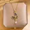 Collar de mariposa con perlas y esmalte en gota, estilo de moda europeo y americano para mujer, colgante de borla con diseño de alta gama, accesorio popular y versátil