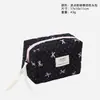 Bolsa de Maquillaje Acolchada Negra de Lunares Transfronteriza con Lazo, Gran Capacidad, Tacto de Alta Gama, Bolsa de Almacenamiento de Artículos de Tocador para Mujer