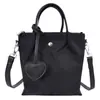 Bolsa de Ombro Única Feminina Versátil para o Dia a Dia, Nova, Simples, Outono 2026, com Pingente, Bolsa Transversal Fashion em Formato de Coração