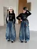 Pantalones de niña primavera y otoño 2026 estilo nuevo moda infantil moda casual pantalones curvos jeans de niña de moda