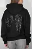 Moda cruzada europea y americana de otoño e invierno, sudadera casual con lentejuelas de ala para mujer y conjunto de dos piezas de color liso versátil, venta al por mayor