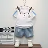 Guapo Chico Verano nueva ropa infantil de manga corta conjunto de camiseta de manga corta de mezclilla con solapa estilo Western para niños Venta al por mayor