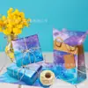 Wx068 Gradiente Azul Púrpura Papel Sydney 17g Dulce de Regalo Papel de Envoltura a Prueba de Humedad Xinghai Decorativo Papel Sydney