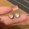 Nuevos pendientes de botón de amor 2023 para mujer, aguja de plata S925, diseño de nicho, pendientes simples de moda, modernos, combinan con todo