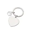 Llavero de Pata de Perro Hueca Transfronterizo Metal Forma de Corazón Impresión Láser Color Material en Blanco Regalo de Vacaciones Llavero Grabado