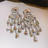 Brincos de borla em formato de flor com zircônia super brilhante, estilo europeu e americano de luxo, brincos de banquete do palácio, brincos de luxo leve de alta qualidade para mulheres