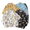 Camisa hawaiana de manga corta con estampado floral, estilo japonés, retro, con grafiti de dibujos animados, para hombre, holgada, para pareja, estudiante, moderna.