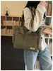 Nova bolsa de ombro feminina transfronteiriça, cor sólida, simples e casual, bolsa de mão de tecido, versátil para o trabalho e estudantes, bolsa tote
