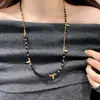 Otoño e Invierno Nueva Cadena de Suéter de Piedra Ojo de Tigre Retro Francesa Lujo Accesible Diseño de Nicho de Gama Alta Accesorios Largos con Perlas