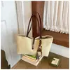 Bolsa de lona grande para mujer, nuevo modelo 2026, de alta gama, lujo ligero, nicho, versátil para ir al trabajo, de hombro y de mano