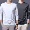 Camiseta casual versátil de manga larga para hombre para otoño, cuello redondo, color liso moderno, cómoda, transpirable y de corte holgado.