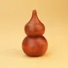 Calabaza de Madera de Azufaifo Golpeada por un Rayo con una Abertura Grande, Aproximadamente 7 cm de Alto. El diseño con una abertura en la parte superior permite colgarlo, y la abertura central permite el almacenamiento.