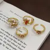 Anel Aberto Dourado Esmaltado Estilo Chinês Retrô Borboleta Flor Folha de Bordo Contas de Concha Recortado Esculpido Acessível Luxo Doce para Mulheres