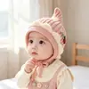 Bonito gorro de lana tejido para bebés en otoño e invierno, unisex, con protección para las orejas y características a prueba de viento, adecuado para niños pequeños como gorro de invierno
