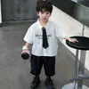 Conjunto de Camisa de Manga Corta de Verano para Niños 2026 Nuevo Estilo de Verano Pantalones Cortos Estilo Academia Infantil Ropa de Bebé de Moda