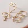 Anillo abierto de diseño de nicho de alta gama, lujo ligero en forma de corazón, conjunto de cinco piezas de anillo de moda personalizado europeo y americano con incrustaciones de diamantes