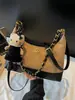Bolso cubo único con patrón de diamantes para mujer, nuevo otoño 2026, moda vintage de alta gama, para hombro, cruzado y de mano
