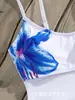 Suministro exclusivo de comercio electrónico transfronterizo desde la fábrica, al por mayor directo en stock, body de retazos de malla con estampado floral elegante y sexy