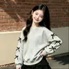 Conjunto de moletom para meninas 2026 outono e inverno novo estilo para crianças mais velhas com blusa base de laço e saia de bolo em estilo preppy conjunto de duas peças