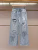 Shenzhen Nanyou alta costura feminina verão novo moda design estiloso nicho strass rasgado jeans reto