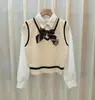 Novo Colete Tricotado Estilo Academia Costura Camisa Falso Duas Peças Curto Ajustado Manga Longa para Usar por Cima Suéter Combina com Tudo para Mulheres
