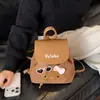 Bolso Transfronterizo para Mujer Otoño Invierno Nuevo Retro Lindo Gato de Dibujos Animados Mochila Sistema Maillard Letras Juvenil Mochila Pequeña