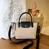 Bolso de mano de moda para mujer 2026 nuevo bolso tote de gran capacidad bolso cruzado casual bolso de hombro versátil para el día a día