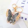 Chaveiro de Borboleta Exquisito com Diamantes Incrustados e Novo Acabamento Vitrificado Transfronteiriço Chaveiro de Bolsa Feminina Pingente de Chaveiro de Carro