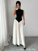 Vestido de Lujo Ligero Estilo Francés Transfronterizo Europeo y Americano 2026, Bloques de Color Blanco y Negro, Cuello Semi Alto, Sin Mangas, Ceñido a la Cintura, Vestido Largo Elegante