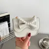 Primavera 2026 Nuevo Mini Lindo Lazo Elegante Versátil Moda Cadena de Perlas Bolso de Hombro Cruzado Transfronterizo