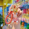 Pingente Criativo de Chaveiro Coelho Transparente Cravejado de Diamante de Resina Moda Chaveiro Pendurado Luz Luxuosa Pendurar em Bolsa de Menina